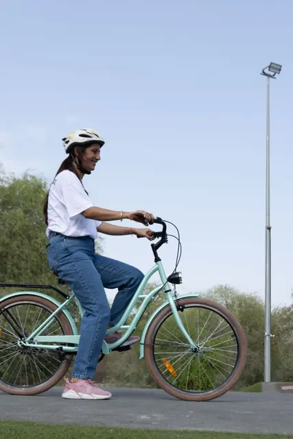 Rider with a mint Mogoo cruiser